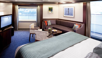 1548636271.1009_c249_Holland America Line Nieuw Amsterdam Interior Neptune Suite 2.jpg